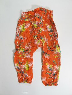 Letní kalhoty pro holky oranžové s kytkmi secondhand Letní kalhoty pro holky oranžové s kytkmi secondhand